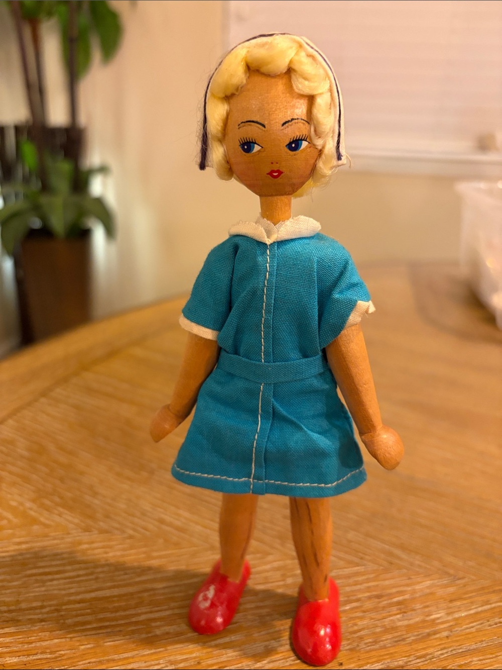 This is a vintage wooden peg jointed poseable doll made in Poland in 1962.